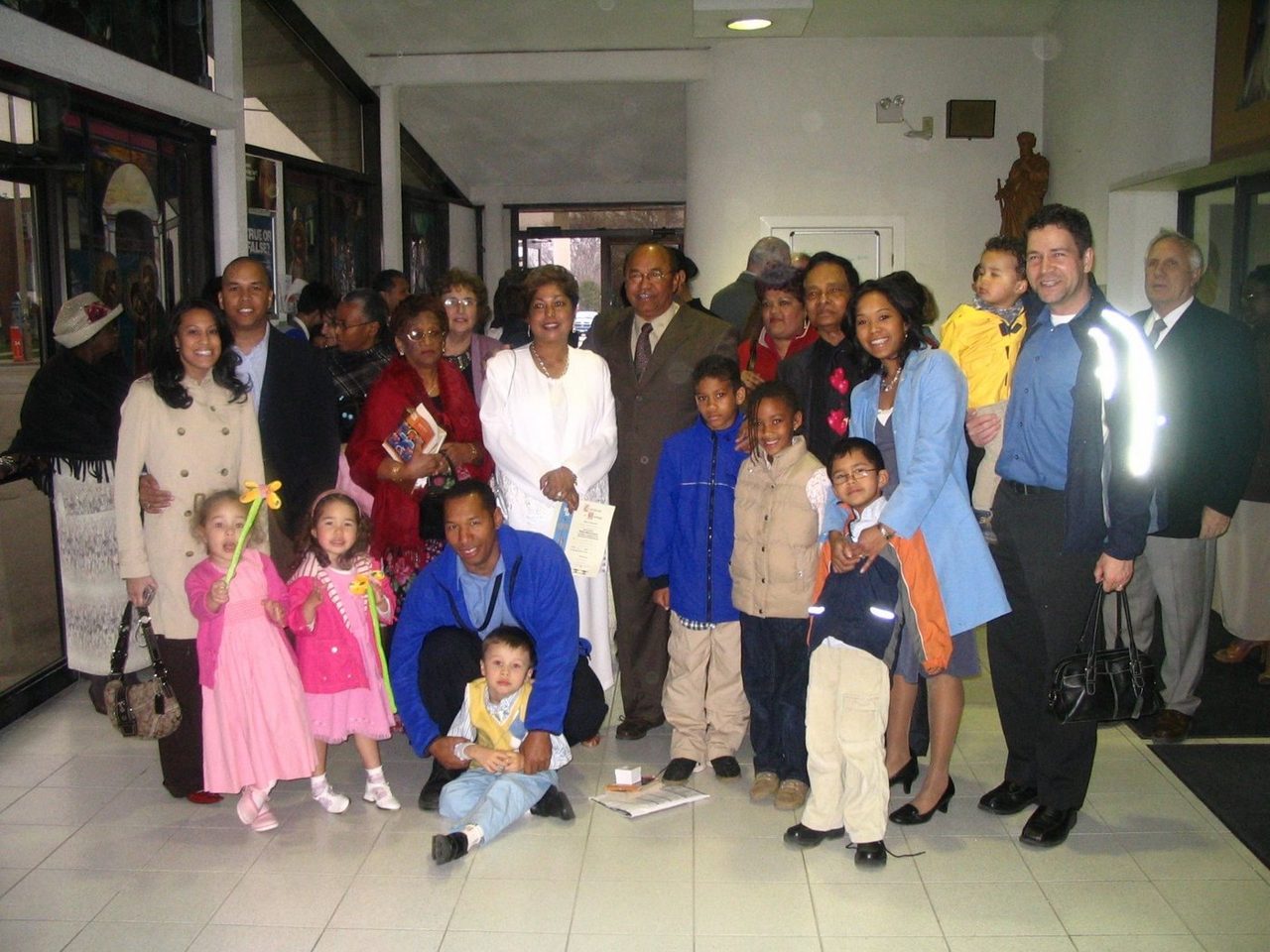 Gabriel in a brown suit and Shanti in white at the centre of a large family group inside the church, April 28, 2007